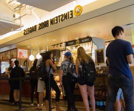 学生 in line to buy food at Chapman Einstein Bros Bagels